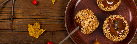 Caramel Apples on Wooden Background. Selective focus.の写真素材