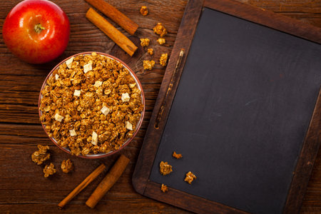 Apple Cinnamon Granola Back to school. Education background concept with copy space. Selective...