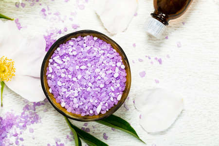 Spa Theme Objects Purple Salt and Spa Theme Objects with Fresh Flowers. Selective focus.の写真素材