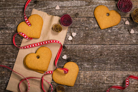 Valentines Day Background. Valentines Day Heart Shaped Cookies on Wooden Background. Selective focus.の写真素材