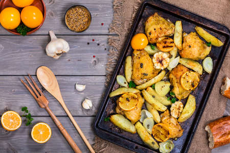 Chicken Thighs Roasted with Meyer Lemon and Potatoes. Selective focus.の写真素材