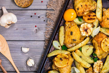 Chicken Thighs Roasted with Meyer Lemon and Potatoes. Selective focus.の写真素材