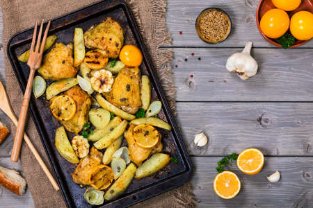 Chicken Thighs Roasted with Meyer Lemon and Potatoes. Selective focus.の写真素材