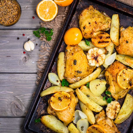 Chicken Thighs Roasted with Meyer Lemon and Potatoes. Selective focus.の写真素材