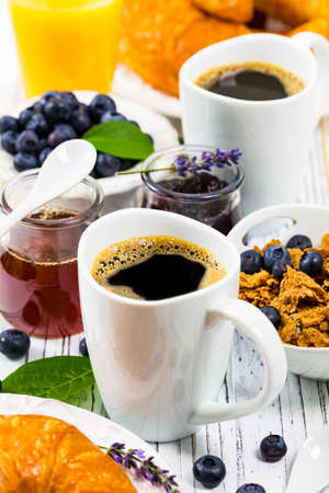 Continental Breakfast with Croissants, Coffee, Cereals and Fruits. Selective focus.の写真素材