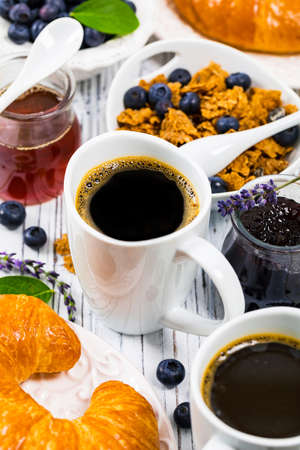 Coffee. Continental Breakfast with croissants, cereals and fruits. Selective focus.の写真素材