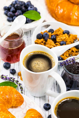 Coffee. Continental Breakfast with croissants, cereals and fruits. Selective focus.の写真素材