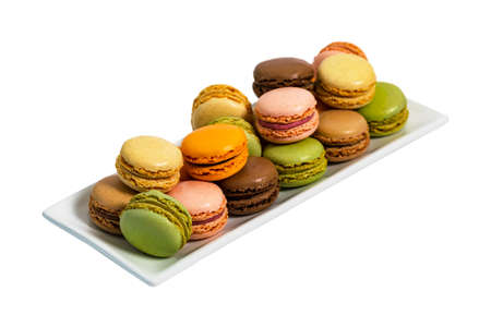 Colorful Macaroons Chocolate, Pistachio, Cherry, Orange, Vanilla Flavor Background Isolated on White Background. Selective focus.の写真素材