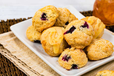 Mini Scones Variety. Orange and Blueberry Mini Scone Cookies. Selective focus.の写真素材