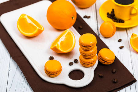 Orange French Macarons with Dark Chocolate and Coffee Filling. Selective focus.の写真素材
