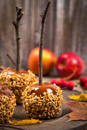 Caramel Apples on Wooden Background. Selective focus.の写真素材