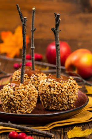 Caramel Apples on Wooden Background. Selective focus.の写真素材