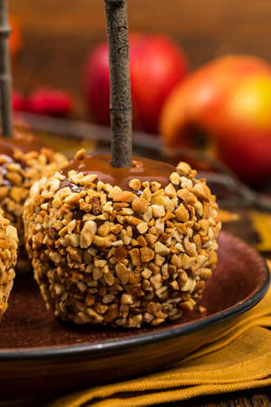 Caramel Apples on Wooden Background. Selective focus.の写真素材