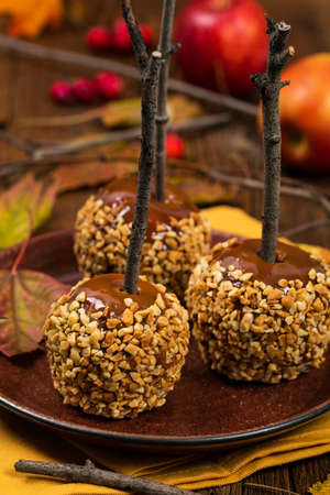 Caramel Apples on Wooden Background. Selective focus.の写真素材