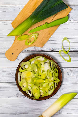 Sliced Leek Green Onion on White Wooden Background. Selective focus.の写真素材