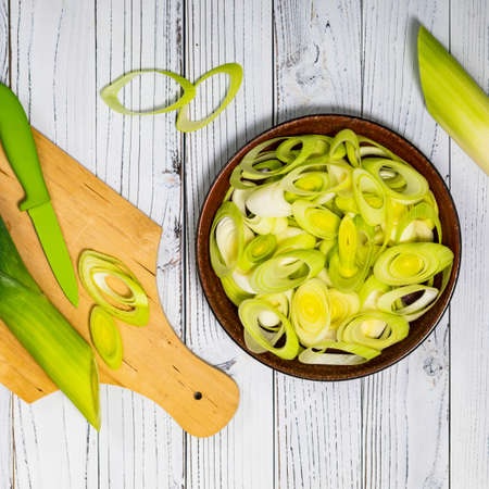 Sliced Leek Green Onion on White Wooden Background. Selective focus.の写真素材