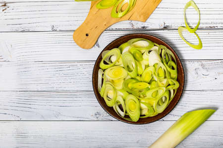 Sliced Leek Green Onion on White Wooden Background. Selective focus.の写真素材