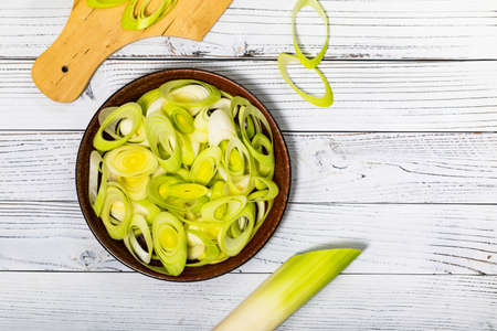Sliced Leek Green Onion on White Wooden Background. Selective focus.の写真素材