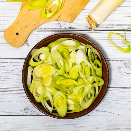 Sliced Leek Green Onion on White Wooden Background. Selective focus.の写真素材