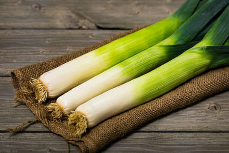 Leek Green Onion on Wooden Background. Selective focus.の写真素材