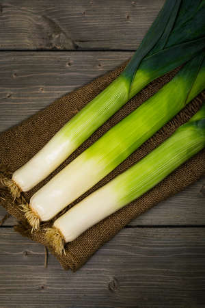 Leek Green Onion on Wooden Background. Selective focus.の写真素材