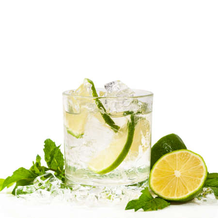 Moscow Mule Cocktail Isolated on White Background. A Moscow mule is a cocktail made with vodka, spicy ginger beer, and lime juice. Selective focus.の写真素材