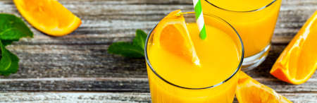 Orange Juice on Wooden Background. Selective focus.の写真素材