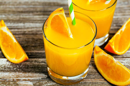 Orange Juice on Wooden Background. Selective focus.の写真素材