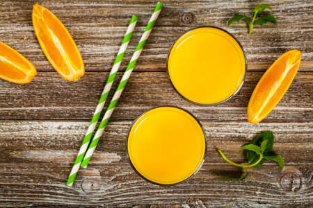 Orange Juice on Wooden Background. Selective focus.の写真素材