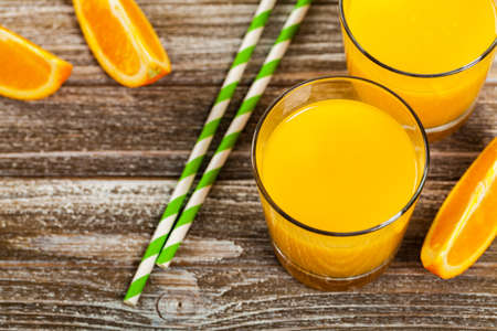 Orange Juice on Wooden Background. Selective focus.の写真素材