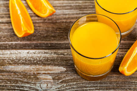 Orange Juice on Wooden Background. Selective focus.の写真素材