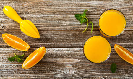 Orange Juice on Wooden Background. Selective focus.の写真素材