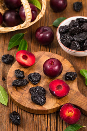 Dried Plums Pitted Prunes and Fresh Plums. Selective focus.の写真素材