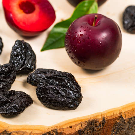 Dried Plums Pitted Prunes and Fresh Plums. Selective focus.の写真素材