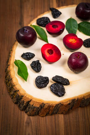 Dried Plums Pitted Prunes and Fresh Plums. Selective focus.の写真素材