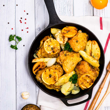 Chicken Thighs Roasted with Meyer Lemon and Potatoes. Selective focus.の写真素材