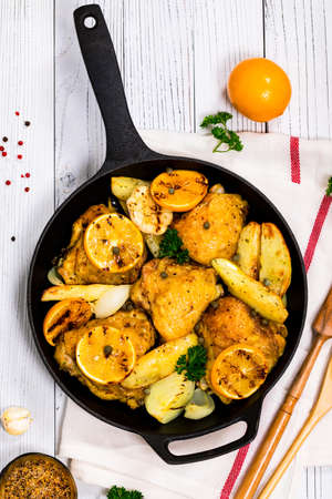 Chicken Thighs Roasted with Meyer Lemon and Potatoes. Selective focus.の写真素材