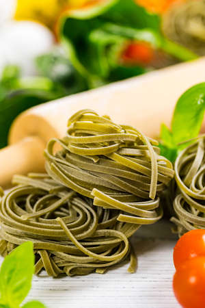 Spinach and Basil Pasta Nests Background. Selective focus.の写真素材