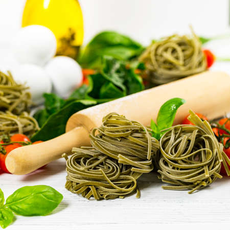 Spinach and Basil Pasta Nests Background. Selective focus.の写真素材