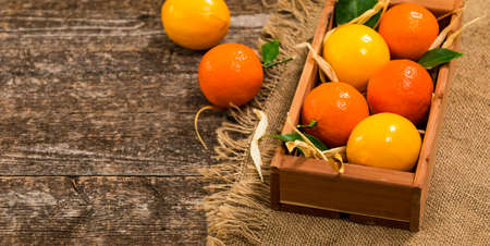 Mandarin Orange or Tangerines on wooden background. Selective focus.の写真素材
