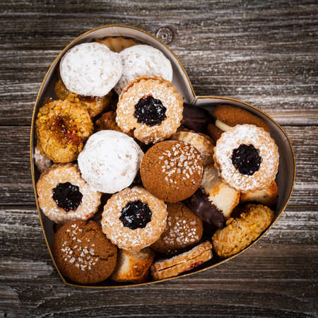 Valentines Day Card Background with Assorted Cookies over Wooden Background. Selective focus.の写真素材