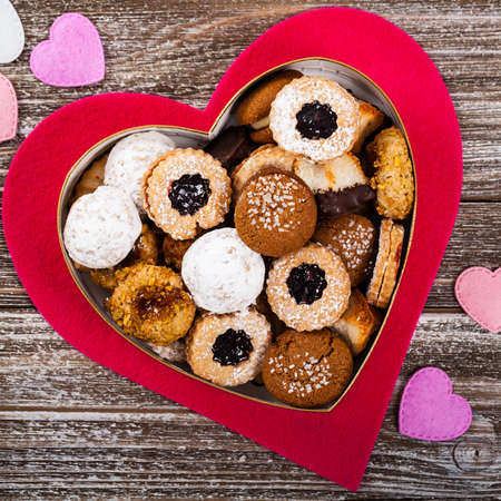 Valentines Day Card Background with Assorted Cookies over Wooden Background. Selective focus.の写真素材