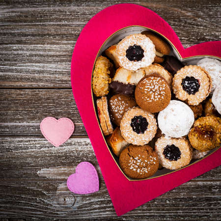 Valentines Day Card Background with Assorted Cookies over Wooden Background. Selective focus.の写真素材