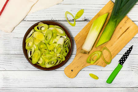 Sliced Leek Green Onion on White Wooden Background. Selective focus.の写真素材