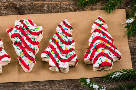 Christmas Tree Cakes on Wooden Background. Christmas Background. Selective focus.の写真素材