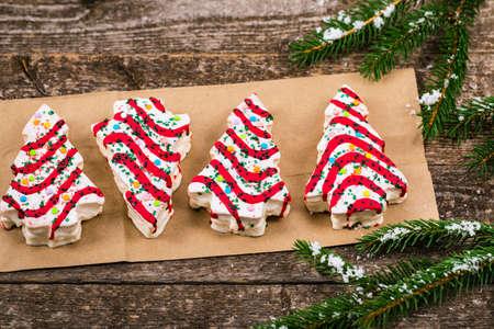 Christmas Tree Cakes on Wooden Background. Christmas Background. Selective focus.の写真素材