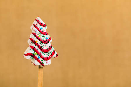 Christmas Background with Christmas Tree Cakes Pops on Stick. Selective focus.の写真素材