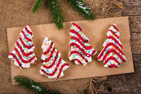 Christmas Tree Cakes on Wooden Background. Christmas Background. Selective focus.の写真素材