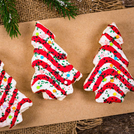 Christmas Tree Cakes on Wooden Background. Christmas Background. Selective focus.の写真素材