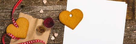 Valentines Day Background. Valentines Day Heart Shaped Cookies on Wooden Background. Selective focus.の写真素材